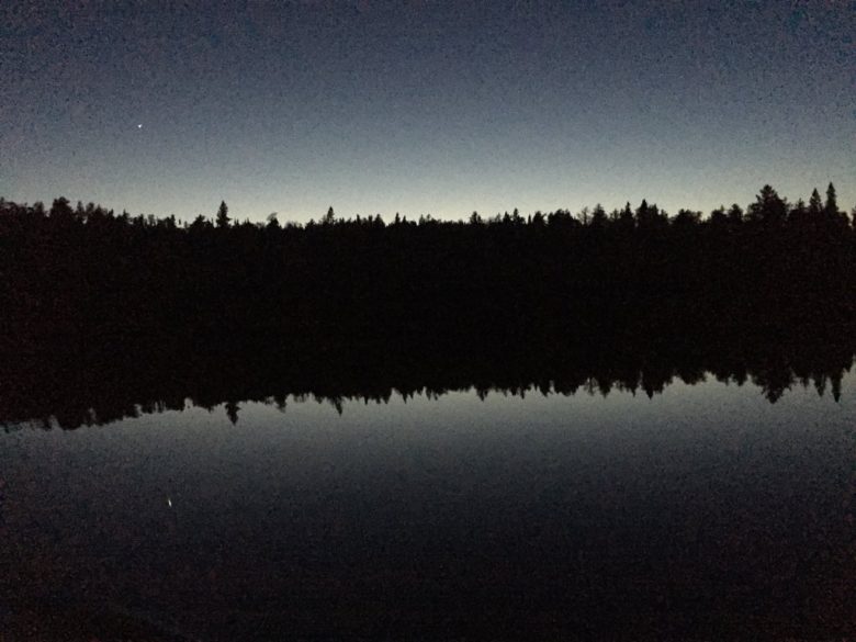 night falls over a lake in ontario