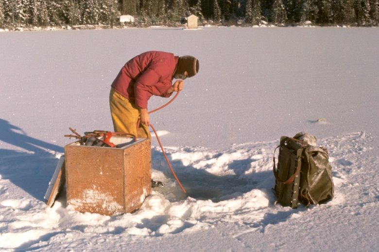 limnologist researches on a frozen lake in Northern Ontario