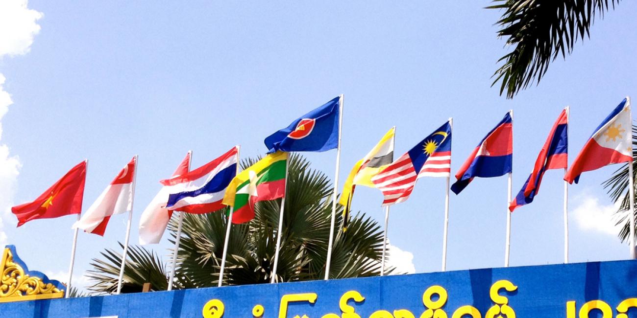 An outdoor shot of flags blowing in the wind.