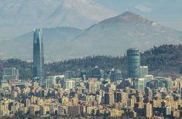 Skyscrapers tower over other city buildings in Chile.