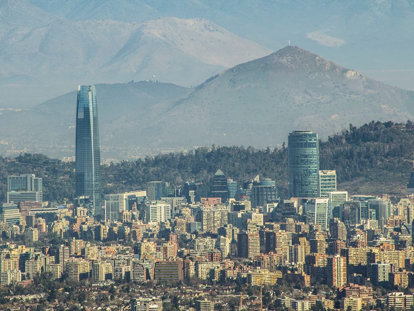 Skyscrapers tower over other city buildings in Chile.
