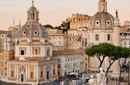 Pedestrians populate a city square in Rome, Italy.