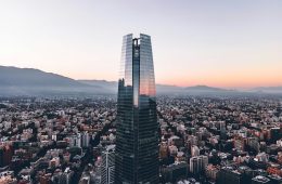 A high-rise building overlooks a city.