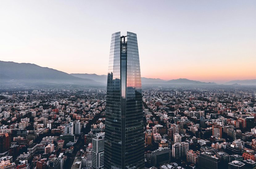 A high-rise building overlooks a city.