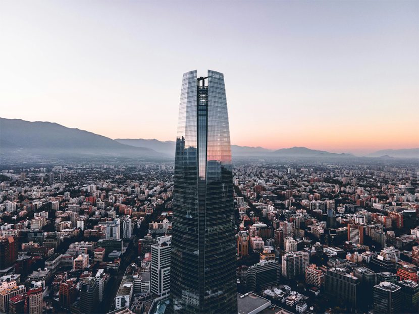 A high-rise building overlooks a city.