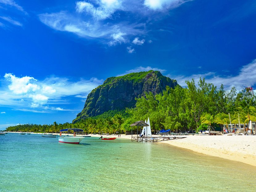 Boats linger along a shoreline.