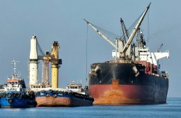 A large cargo ship is docked.