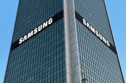 A tall glass building with the word "Samsung."