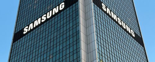 A tall glass building with the word "Samsung."