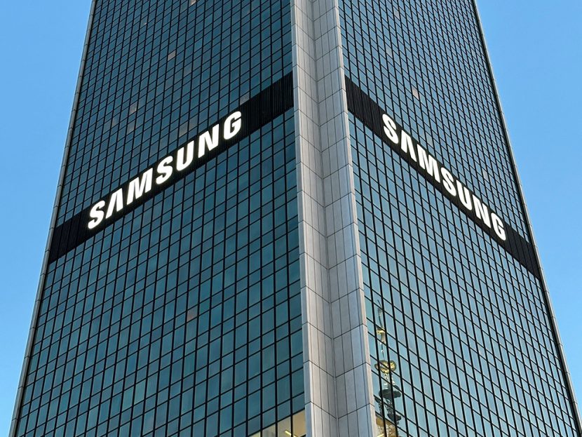 A tall glass building with the word "Samsung."