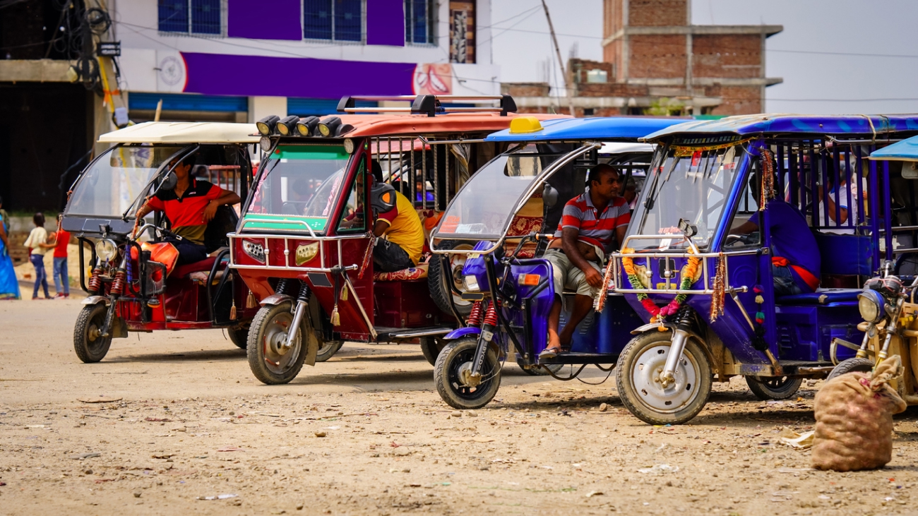 4 e-rickshaws lined up ready for rent