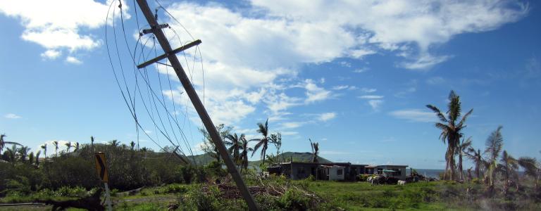Downed electrical poles after a storm in Fiji