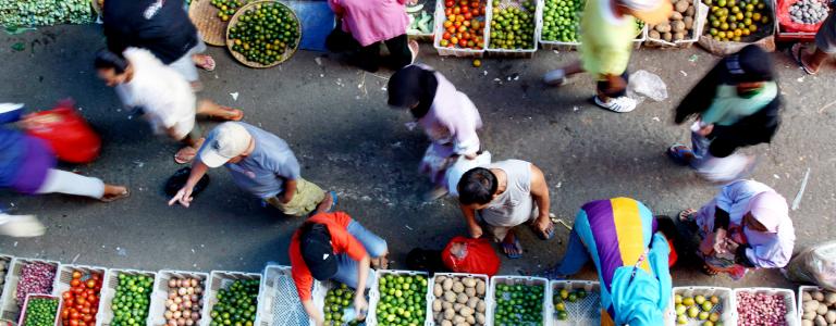 People at a food, fruits and vegetables, market.
