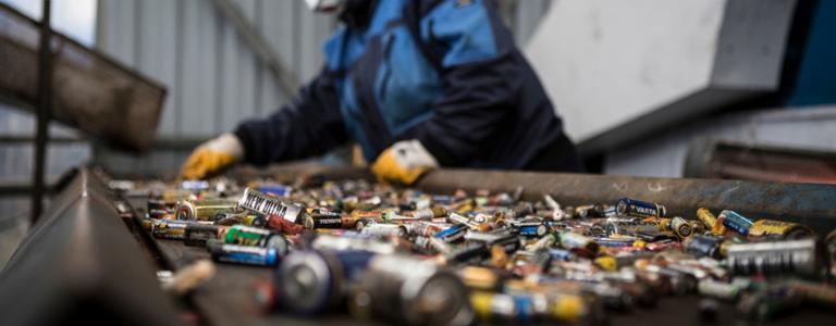 Worker sorting and recycling batteries in Kocaeli, Turkey