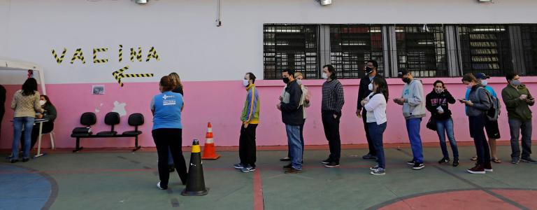People wait in line to get vaccinated against COVID-19 in Sao Paolo, Brazil