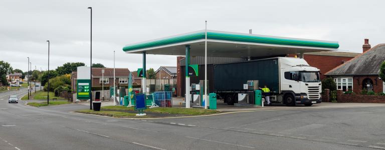 Heavy goods vehicle at a petrol station in England.