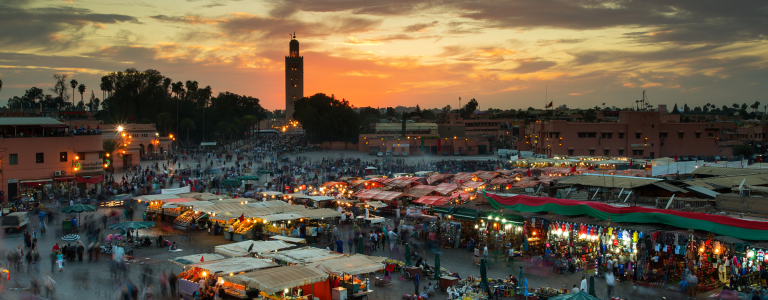 Marketplace in Marrakesh, Morocco, during sunset