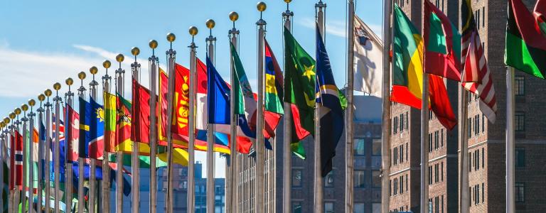 A circle of flags outside the United Nations headquarters in New York
