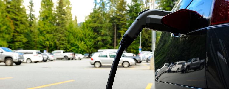 Electric vehicle charging in a parking lot stock