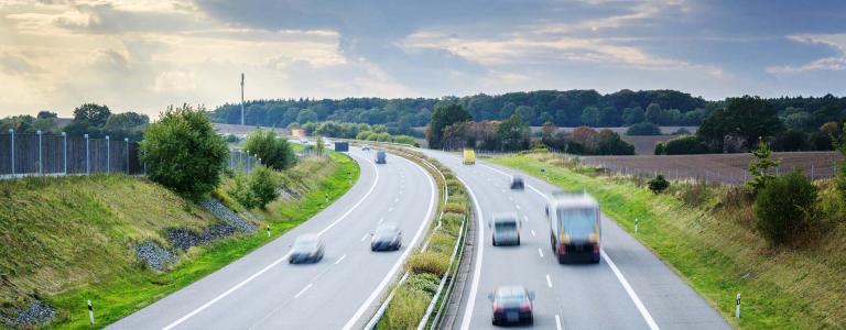 cars drive along a highway