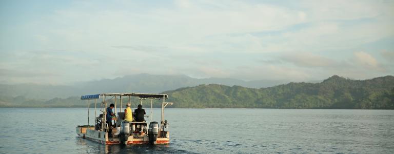 Oyster farming boat fishing off the coast of Fiji.