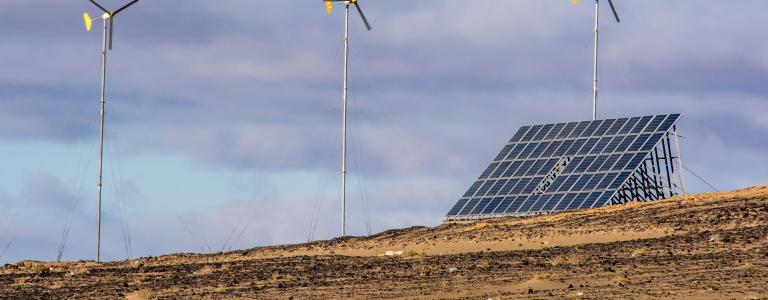 View of Gobi Desert with wind turbines and solar energy panels