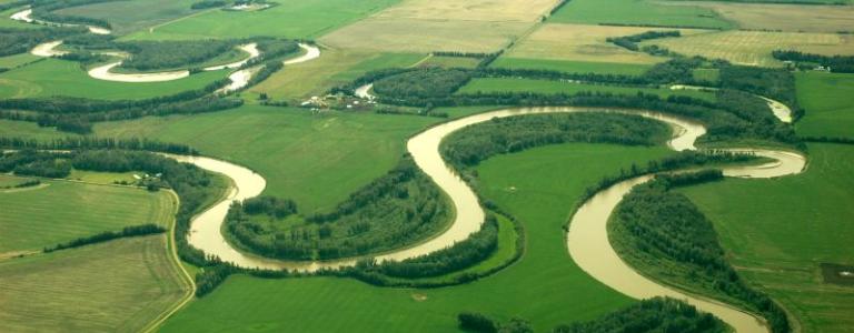 an image of a river winding on a prairie landscape
