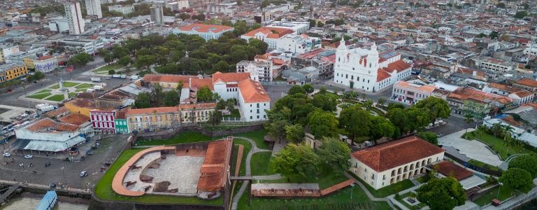 An aerial shot looking over old buildings and parks in Belém, Brazil.