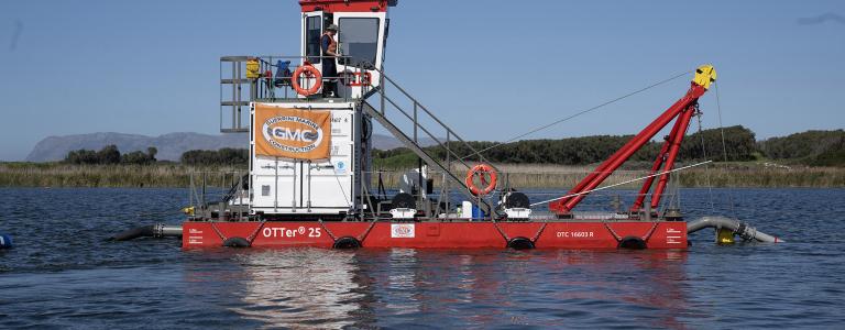 Dredging boat in a river.