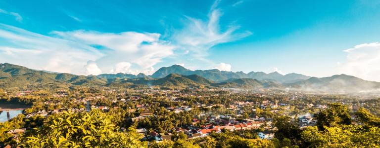 View on a city in the mountains, with a blue sky above