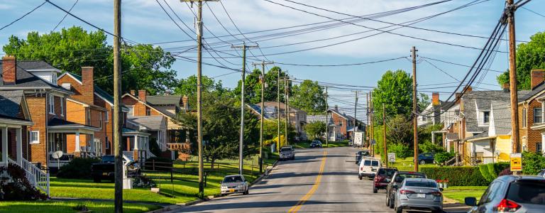 Power lines hang above a community road.