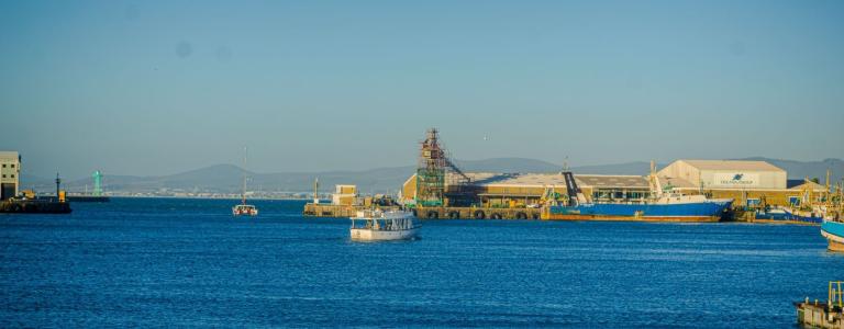 An active port with blue sea below and sky above