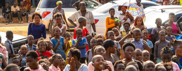 People at a market in Chingola, Zambia