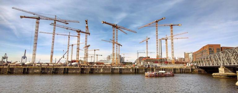 Cranes in a harbour area. 