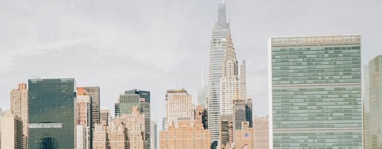 Wide shot of New York's skyline, with the UN headquarters on the right hand side
