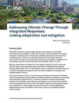 Addressing Climate Change Through Integrated Responses: Linking adaptation and mitigation cover showing an aerial of a city with nature