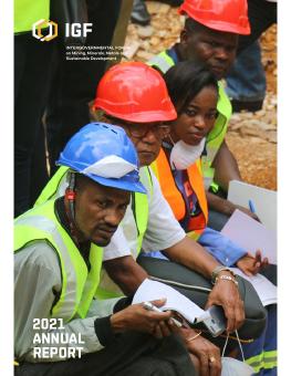 2021 IGF Annual Report showing mining works sitting together at an event