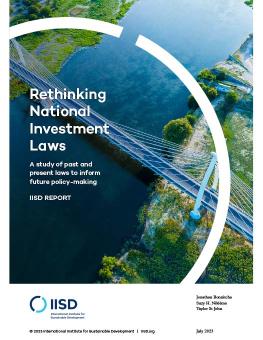 Rethinking National Investment Laws report cover showing a bridge over water surrounded by vegetation.