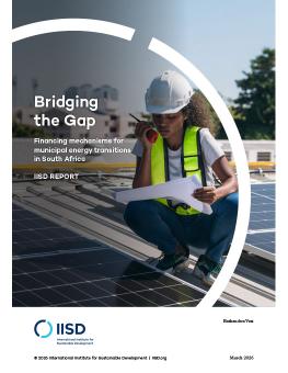 Bridging the Gap report cover showing a worker wearing safety equipment speaking into a walkie-talkie while crouched on a solar panel.