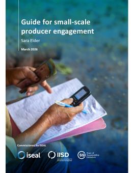 Guide for Small-Scale Producer Engagement guide cover showing a person's hands holding money and a cell phone, while a notebook sits on their lap.