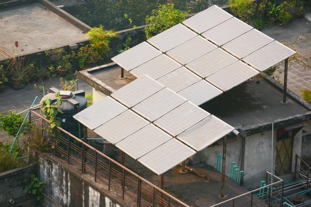 Solar panels pictured on a building roof.
