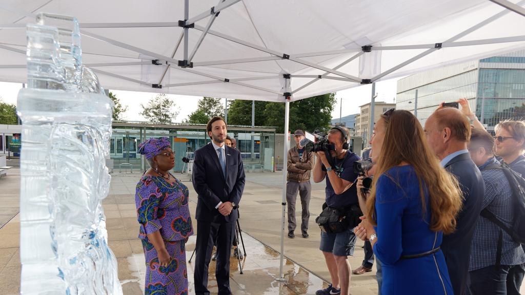WTO Director-General Ngozi Okonjo-Iweala and Colombian Ambassador to the WTO Santiago Wills at the Stop Funding Overfishing display outside the Palais des Nations in Geneva, Switzerland, on June 8, 2022.