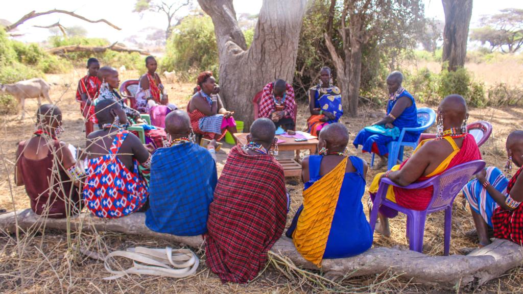 Kenyan women sitting in circle discussing