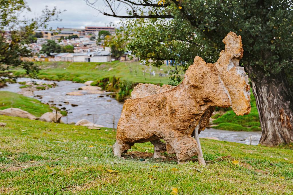 SUNCASA | Goat sculpture made from salvaged tiles and stones as part of the SUNCASA's "Art and Litter Traps" initiative.