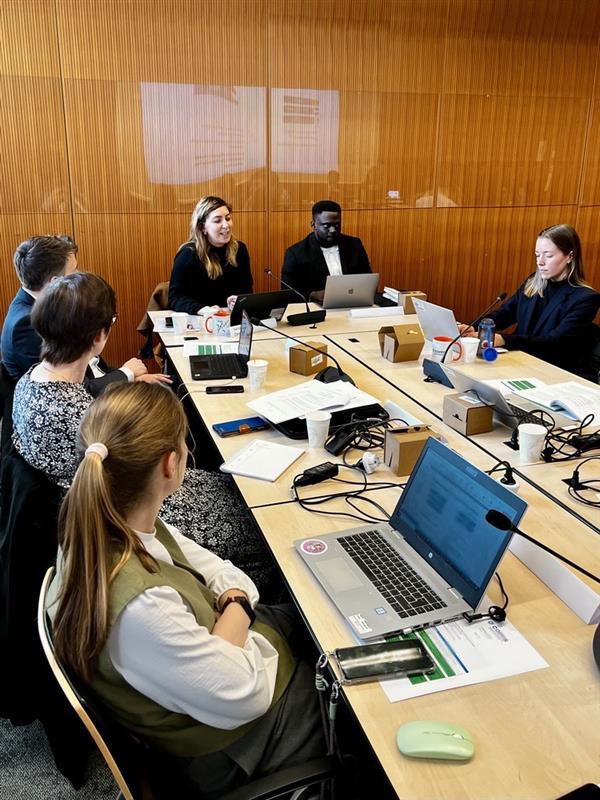 Members of COFFIS have a table discussion.
