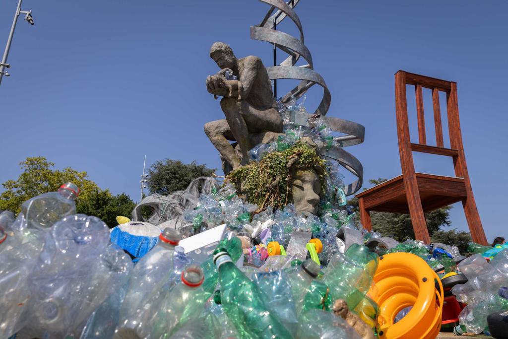 As ministers arrive at the INC5.2 negotiations, plastic surrounds the Thinker's Burden outside the venue to highlight the urgency of addressing the plastic pollution crisis.