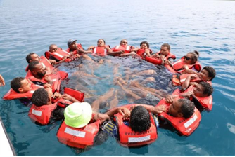 people-in-a-circle-wearing-life-jackets-in-a-river-Fiji