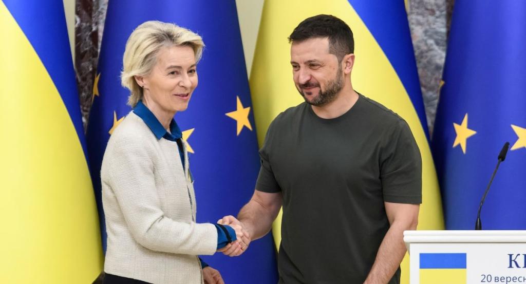 Ursula von der Leyen and Volodymyr Zeleskyy shake hands.