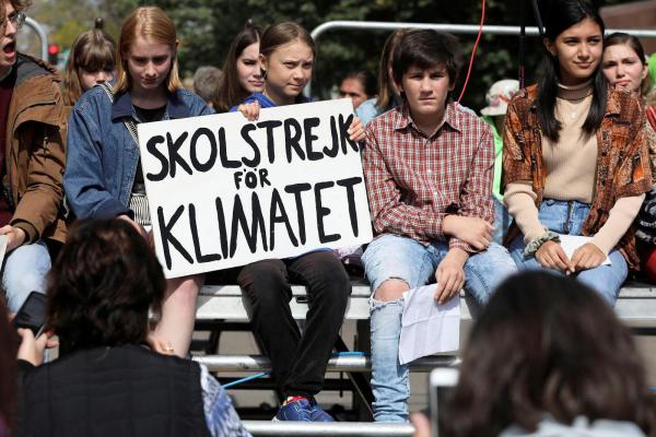 Greta Thunberg protesting with fellow activists