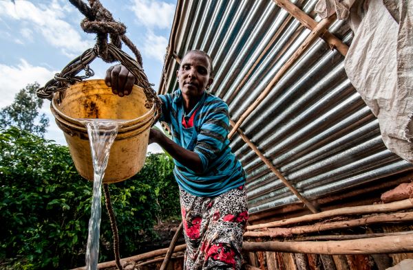 A woman farmer in Ethiopia harvests rainwater in her adaptation to the effects of climate change